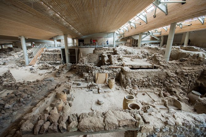 Archaeological Bus Tour to Akrotiri Excavations & Red Beach - Perissa black sand beach for swimming and a meal break