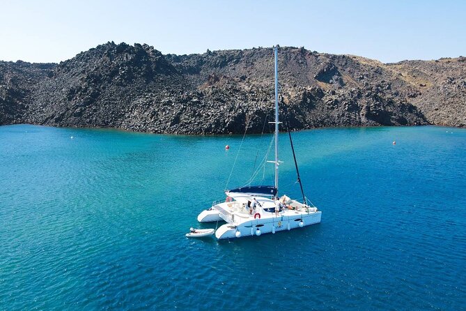 Best of Santorini Private Half-Day Catamaran Cruise with transfer and meal - Red Beach: volcanic colors you can see from the water, plus a swim stop