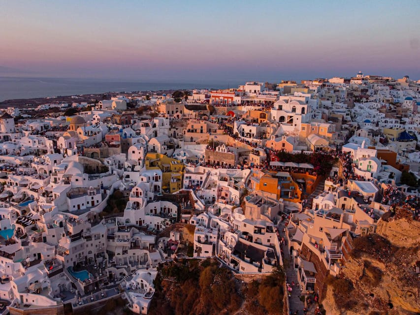 From Fira: Santorini Highlights Minibus Tour with Oia Sunset - Firostefani blue-domed church and a classic Santorini view walk
