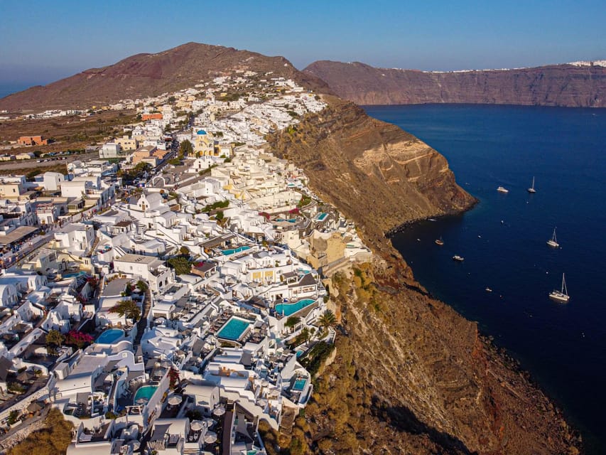 From Fira: Santorini Highlights Minibus Tour with Oia Sunset - Oia Village at sunset: the payoff for a long day