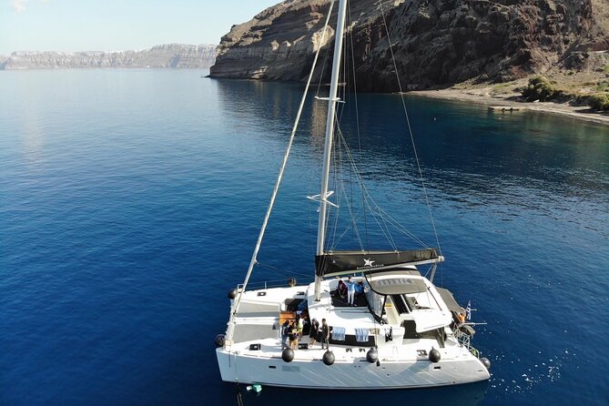 Half-Day Exclusive Catamaran Cruise in Santorini with Meal and Open Bar - Red Beach Stop: A Fast Hit of Color and a Real Swim