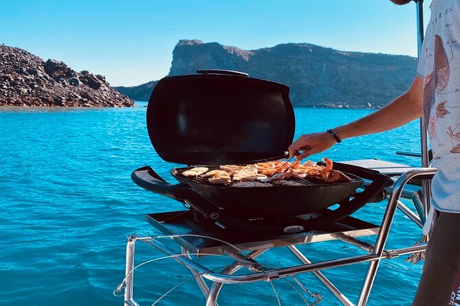 Half-Day Exclusive Catamaran Cruise in Santorini with Meal and Open Bar - The Calm Cruise Parts: Old Port of Fira and Black Mountain Views