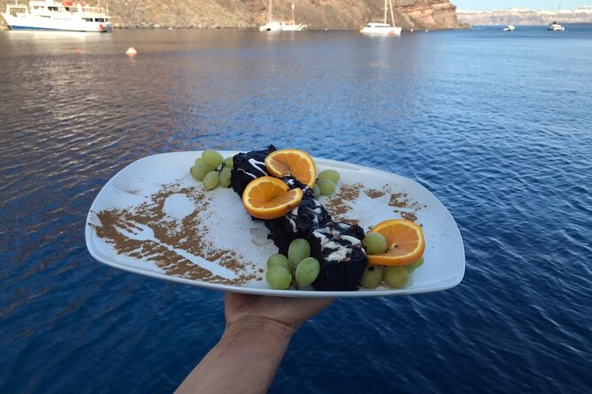 Half-Day Tailor-made Private Catamaran Cruise in Santorini - Red Beach: photo time on Santorini’s reddish cliffs