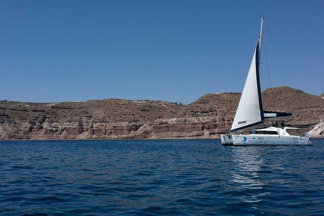 Luxury Caldera Cruise with a rich BBQ meal and drinks! - Sailing toward Santorini Volcano, hot springs, and volcanic-area beaches
