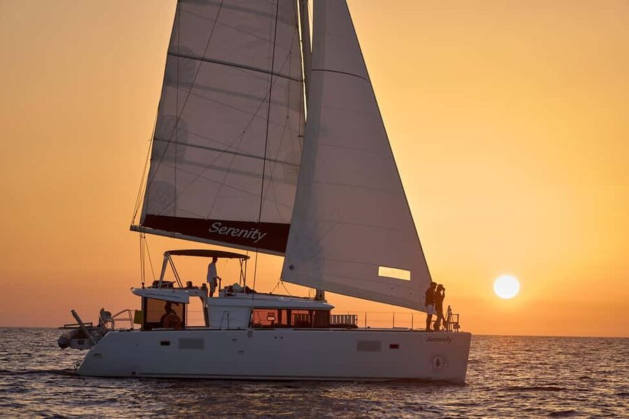 Luxury Catamaran Sunset Cruise with BBQ Fresh Fish & Drinks - Pickup, timing, and why the minibus matters on Santorini