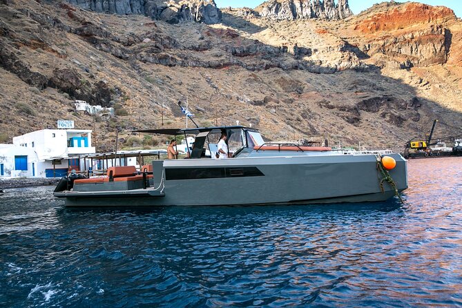 Luxury Private Power Catamaran Tour in Santorini - Sunset cruise mode: wine on deck with the caldera cooling down