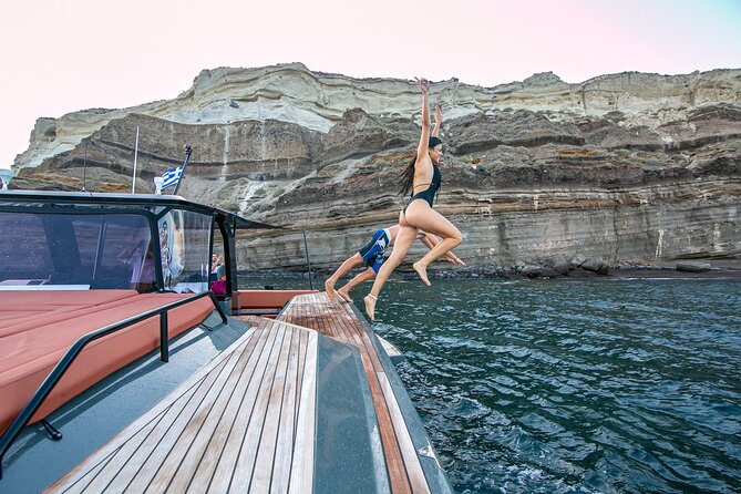 Luxury Private Power Catamaran Tour in Santorini - Lighthouse stop and the Indian Rock views