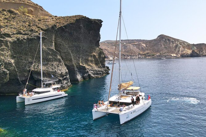 Luxury Santorini Sunset Cruise: Dinner, BBQ, Open Bar, Transfers - Hot Springs Stop at the Volcano of Santorini
