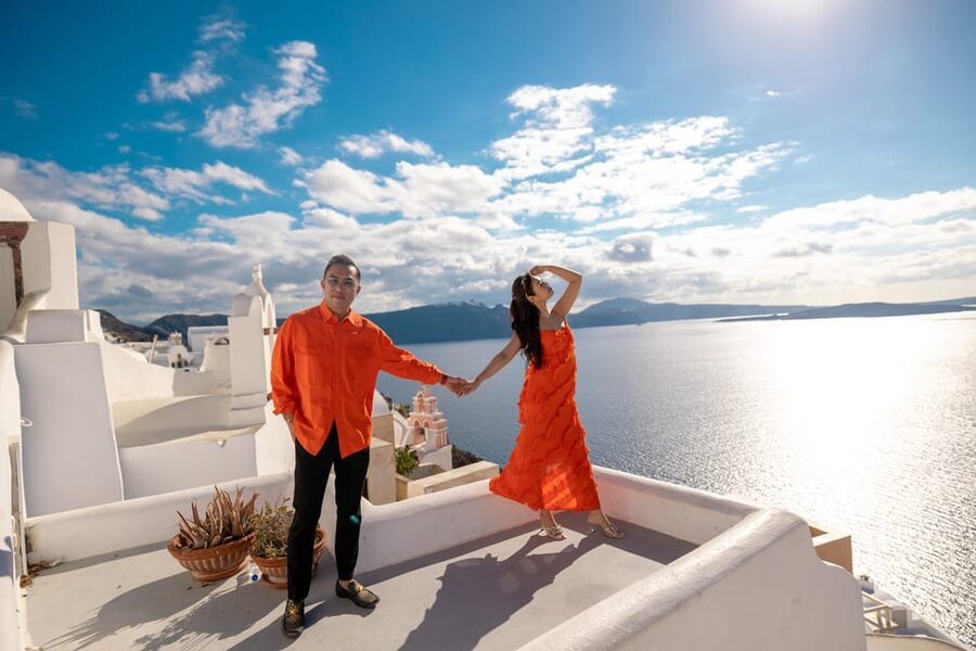 Oia: Couple photoshoot with 30 edited Photos - Flying dress option: the wind-and-stairs tradeoff