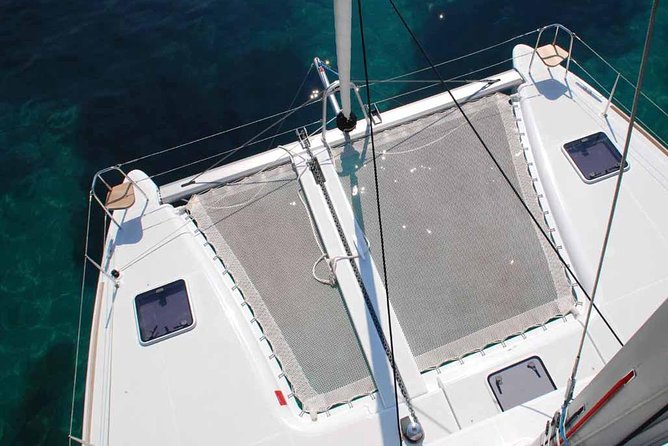 Private Morning Tour Lagoon 400-380 Sailing in Santorini ,lunch, drink, transfer - White Beach: Your Long Swim Stop and Snorkeling Time