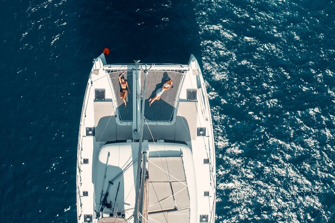 Romantic Sunset Catamaran Caldera Cruise incl. Meal & Drinks - Oia sunset from the water: the payoff
