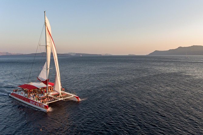 Sailing Catamaran Cruise in Santorini with BBQ, Drinks and Transfer - Entering the day on a moving catamaran