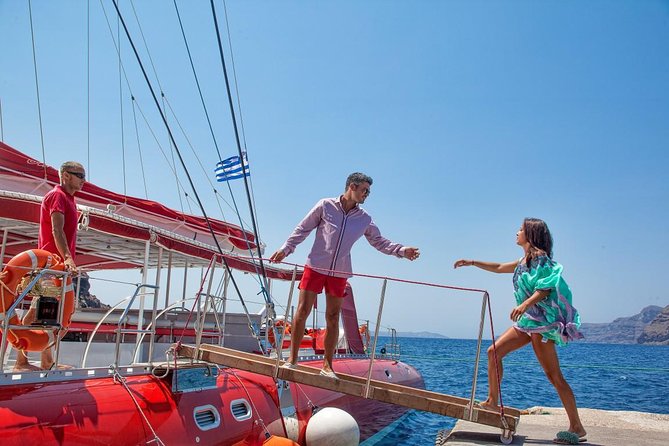 Sailing Catamaran Cruise in Santorini with BBQ, Drinks and Transfer - Red Beach jump-in time: short swim, big color payoff