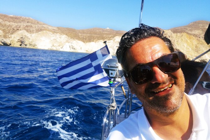 Sailsational Luxury Santorini Catamaran Sunset Cruise with Dinner - First swim-and-color stops: Red Beach and White Beach