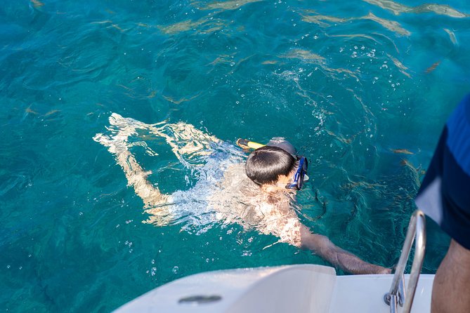 Santorini Caldera Gold Day Cruise with BBQ on board and Open Bar - Onboard Setup: Catamaran Vibe, Drinks, and Lunch Without Fuss