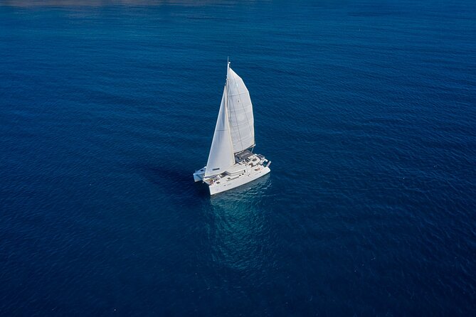 Santorini: Caldera Private Catamaran Cruise with Meal & Drinks - Mesa Pigadia’s Black Rocks and Quiet Water Time