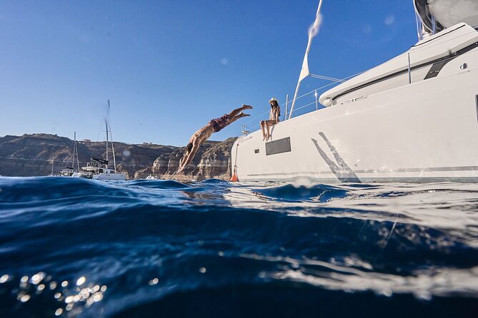 Santorini: Caldera Private Catamaran Cruise with Meal & Drinks - Lighthouse Bay and the South Side Vantage