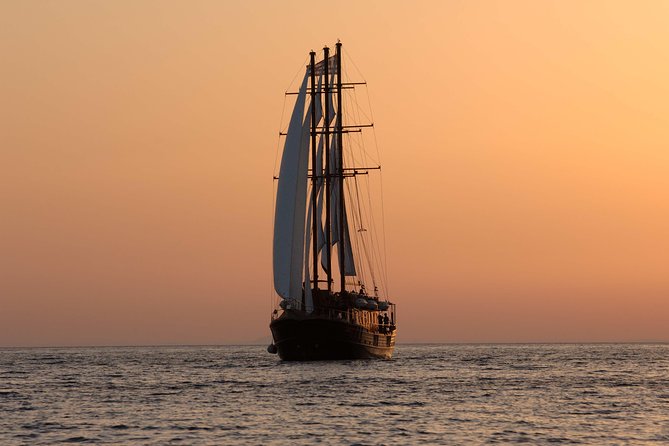 Santorini Caldera Sunset Sailing Cruise with Dinner and Wine - Sailing comfort, group size, and where to sit for the best views