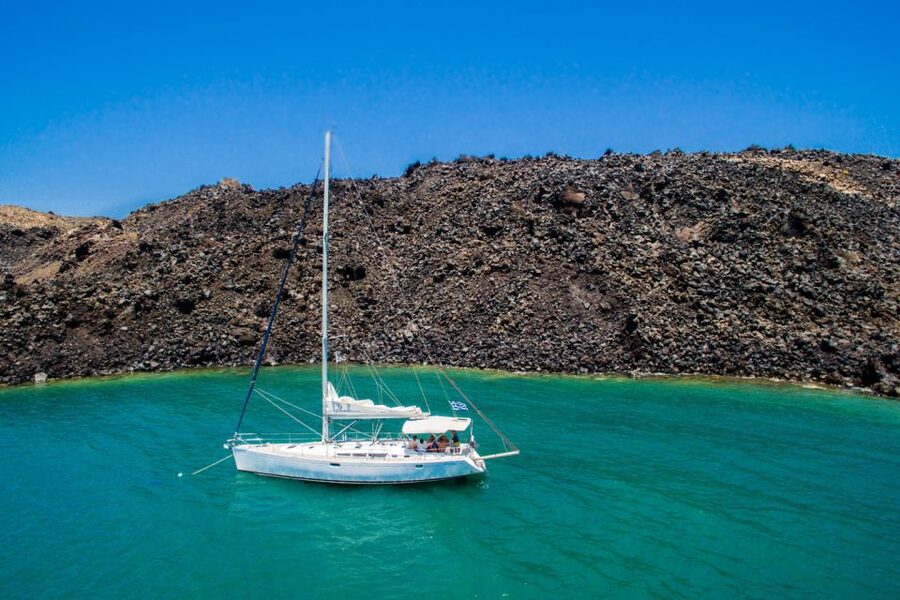 Santorini Caldera: Sunset Sailing Cruise with Meal - Akrotiri Lighthouse Views on the Way Back