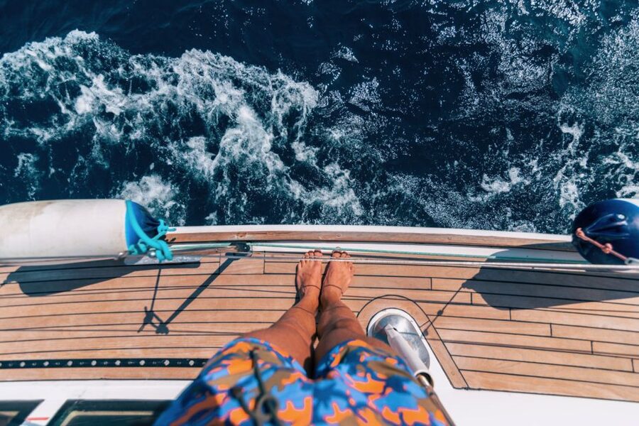 Santorini Caldera: Sunset Sailing Cruise with Meal - Sailing Past Fira, Firostefani, and Imerovigli from Sea Level