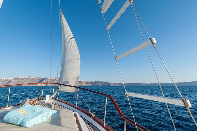 Santorini Caldera Sunset Traditional Cruise with Meal and Drinks - From Ammoudi Bay into Thirassia: swimming time and a real onboard lunch