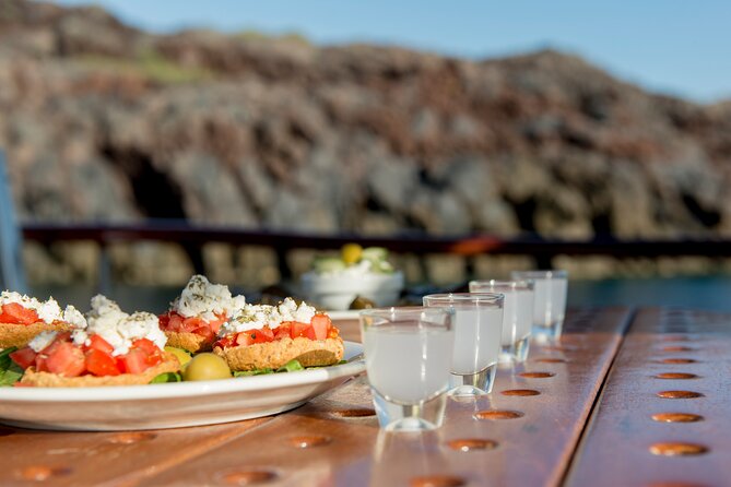 Santorini Caldera Sunset Traditional Cruise with Meal and Drinks - White Beach: private-feeling color, and why boat access changes the vibe
