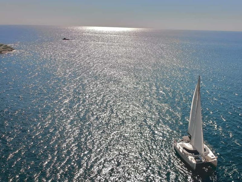Santorini: Catamaran Cruise with Food and Drinks - Caldera sailing, passing the lighthouse and Indian Rocks