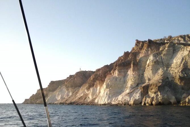 Santorini Catamaran Cruise with Fresh Meal and Open Bar - Sailing Passes: Lighthouse Views, Indian Rock, and the Caldera’s Story