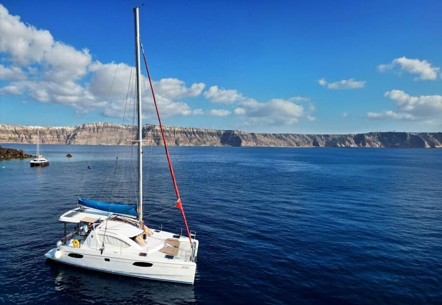 Santorini: Catamaran Cruise with Greek BBQ and Drinks - Welcome On Board: Wine or Soft Drinks and the Crew Vibe
