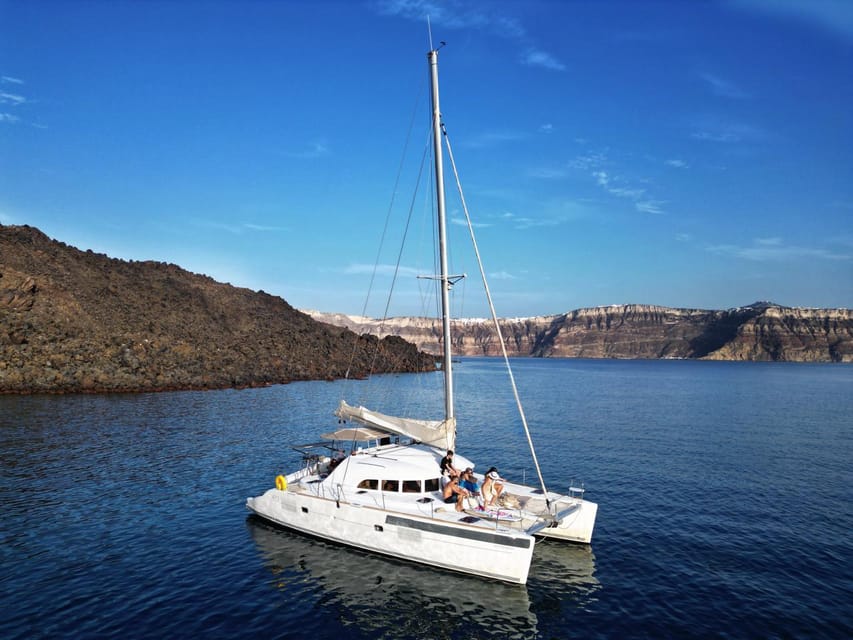 Santorini: Catamaran Cruise with Greek BBQ and Drinks - Nea Kameni Volcanic Hot Springs: Mineral Water, 30 Minutes, and the Smell Factor