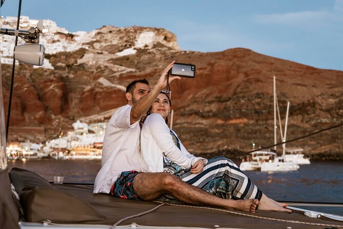 Santorini Catamaran Cruise with Greek Meal, Open-Bar and Sunset - Caldera Views as the Main Event, Plus a South-Coast Sail