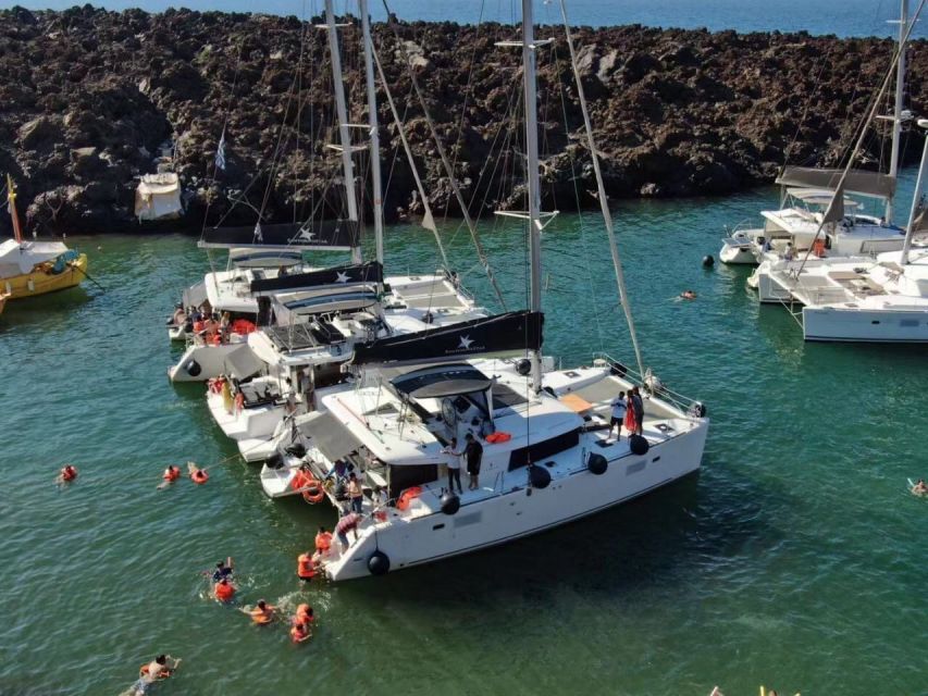 Santorini: Catamaran Cruise with Meal & Open Bar - Hot Springs in Warm Volcanic Water: Why This Stop Matters