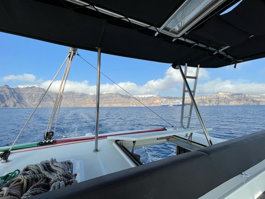 Santorini Catamaran Cruise with Swimming, Meal and Open Bar - Hot springs at Palea Kameni, warm water in a volcanic setting