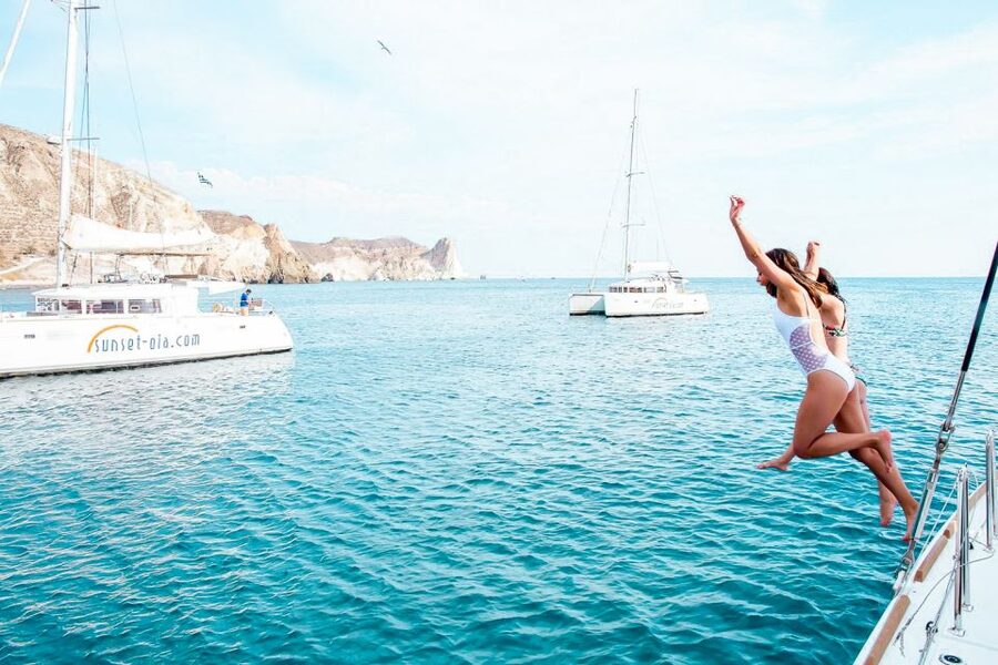 Santorini: Catamaran Tour with BBQ Meal and Unlimited Drinks - Sunset From Below Oia, and How to Dress for It