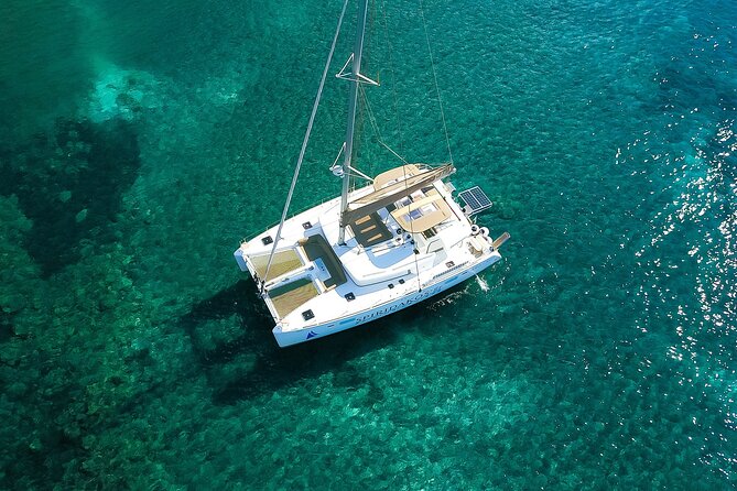 Santorini Classic Catamaran Cruise with BBQ, Drinks and Transfers - Sail By Caves and Rock Formations: The Caldera in Passing