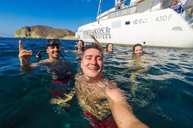 Santorini Classic Catamaran Cruise with BBQ, Drinks and Transfers - Stop 1: Red Beach Photo Stop, Great Photos, No Swimming