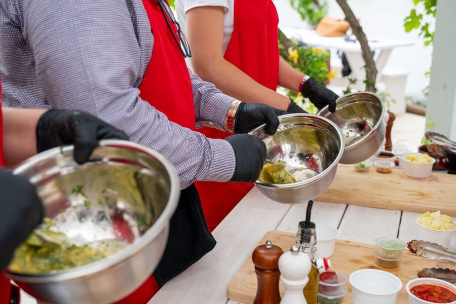 Santorini: Cooking Class with Lunch and Wine Tasting - Cooking on Kamari’s Black Beach, not in a studio kitchen