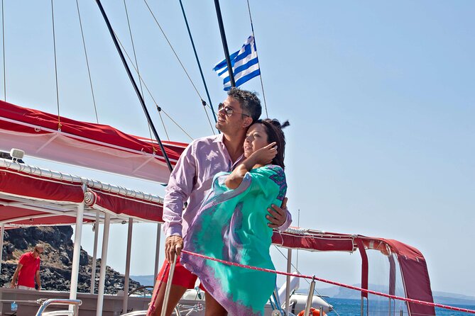 Santorini Cruise on Catamaran with BBQ & Open Bar - The caldera cruise moments: Old Lighthouse, Indian Rock, and Black Mountain