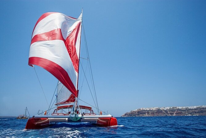 Santorini Cruise on Catamaran with BBQ & Open Bar - Stop 2 at Red Beach: snorkeling where cars cannot go