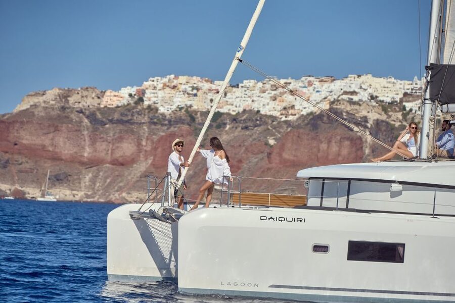 Santorini: Day Luxury Catamaran Cruise with Meal & Drinks - From pickup to catamaran: how the morning starts