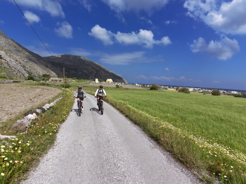 Santorini: Electric Mountain Bike Adventure - Caldera views and a chapel inside a volcanic ash cave