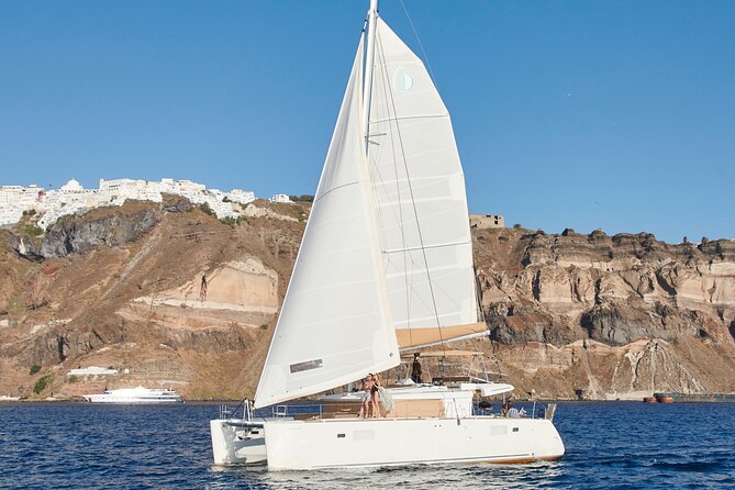 Santorini Gold Catamaran Cruise with BBQ, Drinks and Hotel Pickup - Santorini Volcano and hot springs: fun water time, with realistic expectations