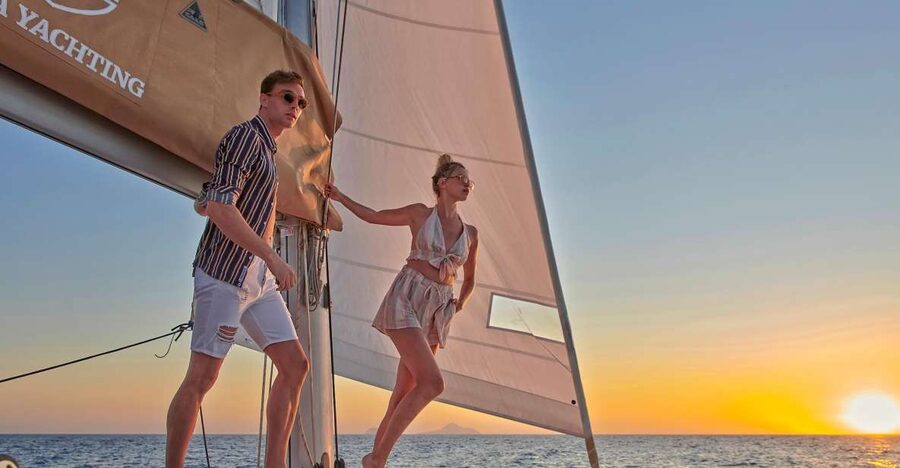 Santorini Gold Catamaran Cruise with Snorkel, BBQ & Open Bar - The Red Beach stop: iconic cliffs, real swimming, and easy onboard snacks
