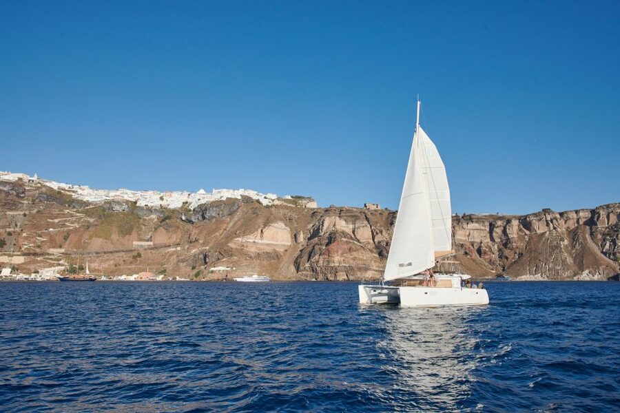 Santorini Gold Catamaran Cruise with Snorkel, BBQ & Open Bar - White Beach and the Venetian lighthouse: views from the water that you can’t get on a quick walk