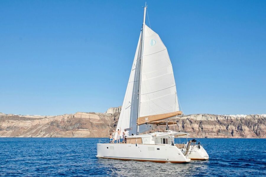 Santorini Gold Catamaran Cruise with Snorkel, BBQ & Open Bar - Caldera cliff views from the boat: why the in-between time matters