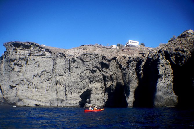 Santorini Guided Sea Kayaking with Light Lunch and Pick-up Option - The sea cave moment and why it feels special