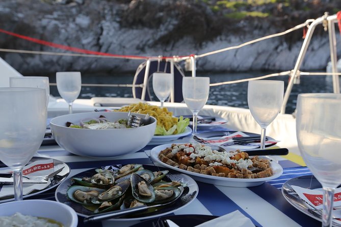 Santorini Half Day Catamaran Private Cruise incl. Meal, Drinks & Free Transport - Vlyhada Marina: why the starting point feels like Santorini’s real working edge