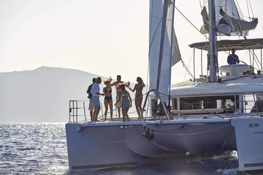 Santorini: Luxurious Catamaran Cruise with Meal & Open Bar - Your itinerary in plain language: hot springs, then Red and White Beach swims