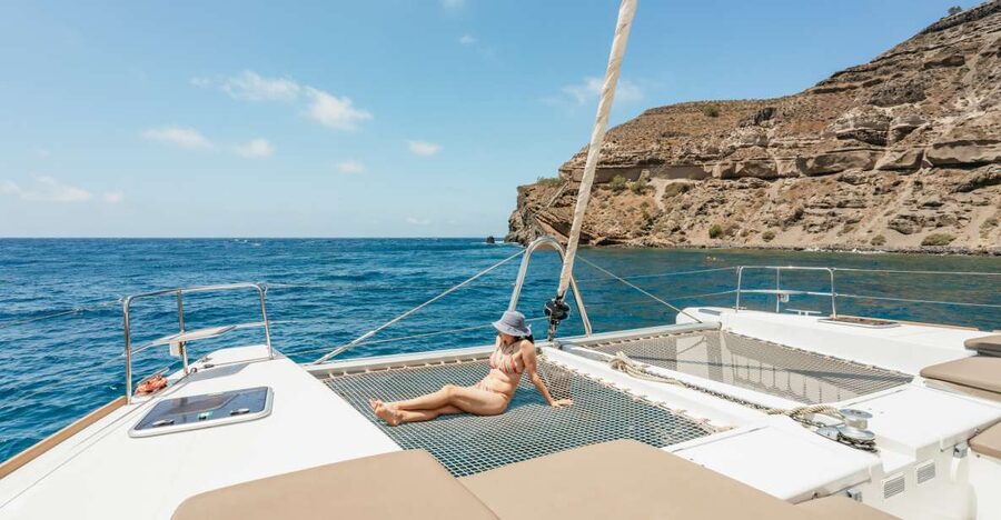 Santorini: Luxury Catamaran Day Trip with Meal and Open Bar - Morning sailing vs late-afternoon Oia sunset: what changes