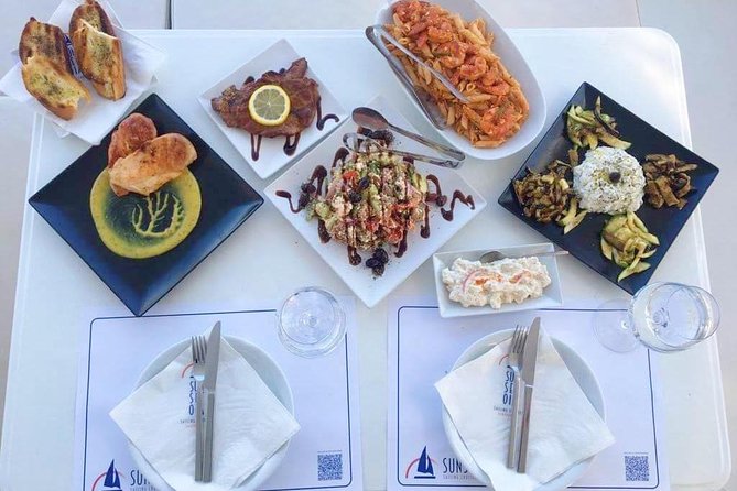 Santorini Luxury Catamaran Sunset Cruise with BBQ, Drink and Transfer - Luxury catamaran cruising from Ammoudi and Athinios ports